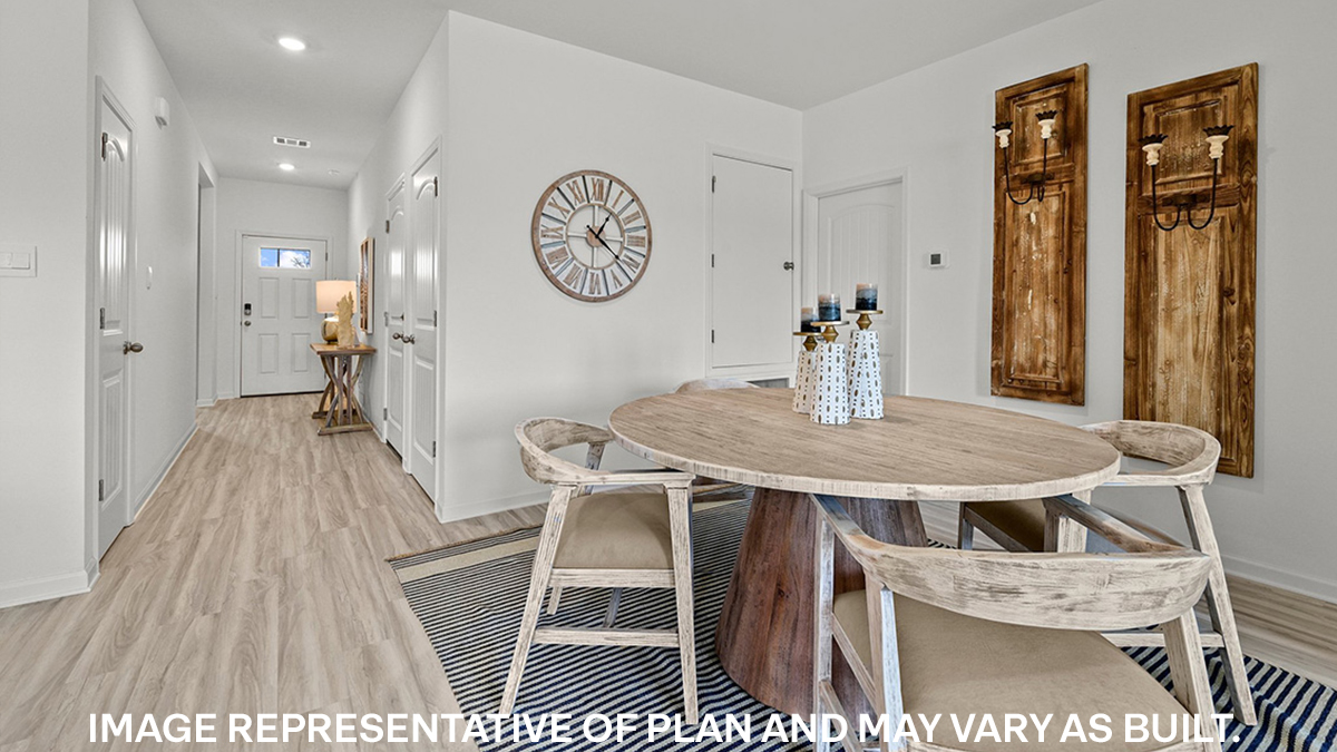 open-concept dining room with access to laundry room