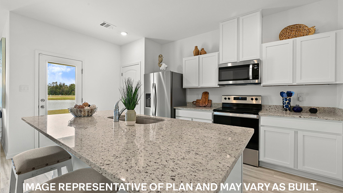 white kitchen island with stainless steel appliances