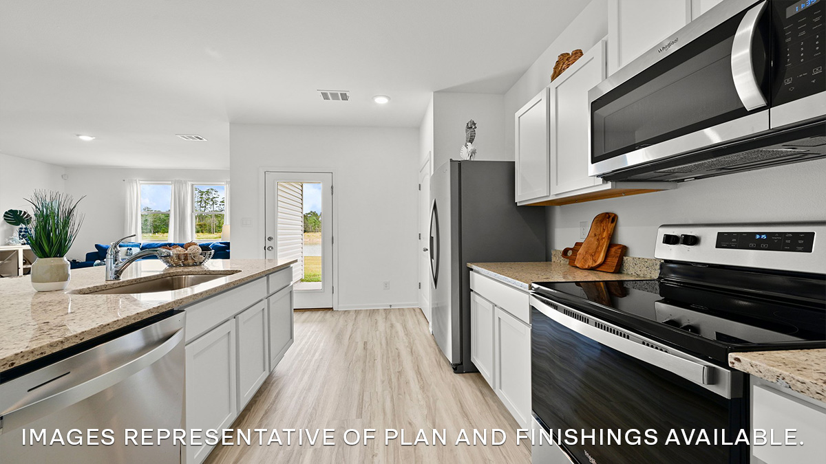 white kitchen island with stainless steel appliances