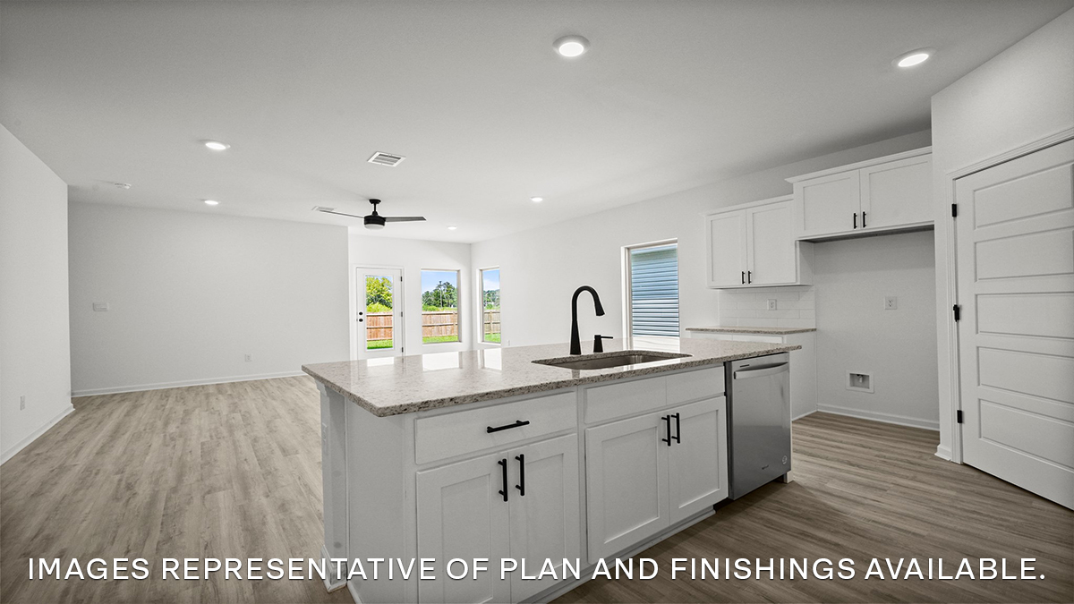 white kitchen island with stainless steel appliances