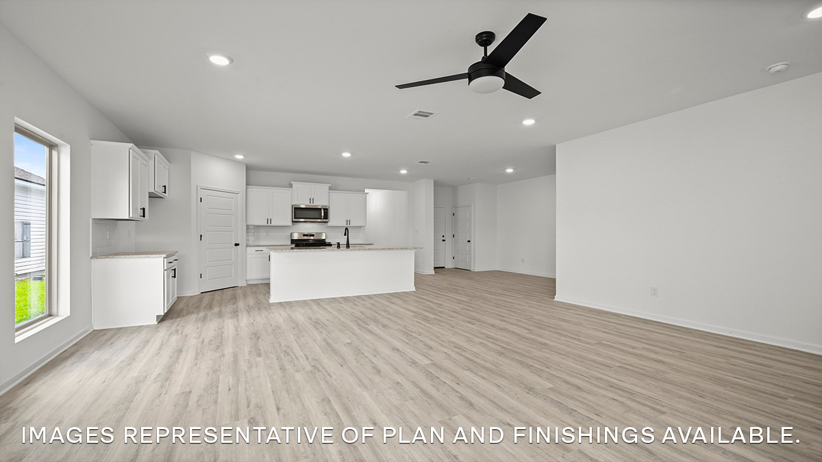 open-concept living room, kitchen and dining space