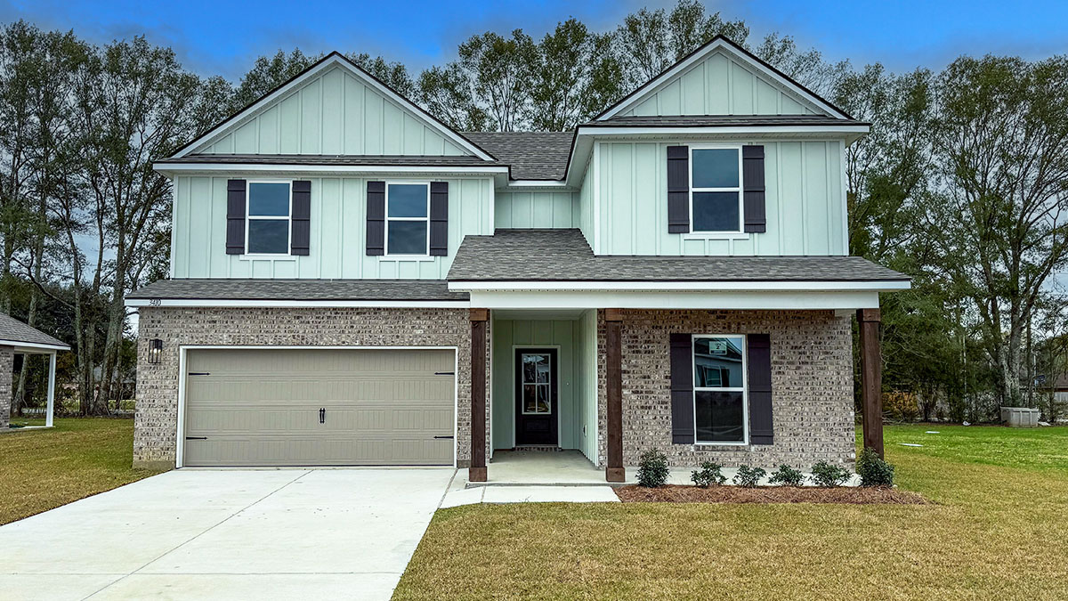 dual-story home with mint hardi vinyl and and tan brick with black front door and shutters with porch and two-car garage
