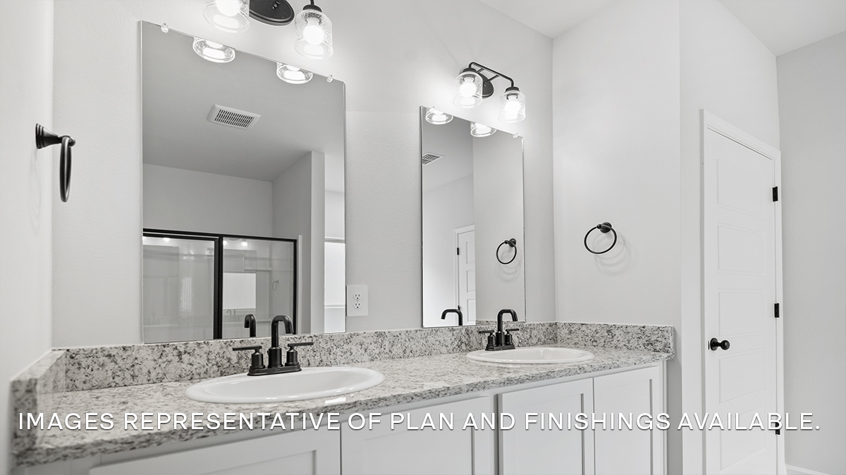 White dual vanities in the primary bathroom