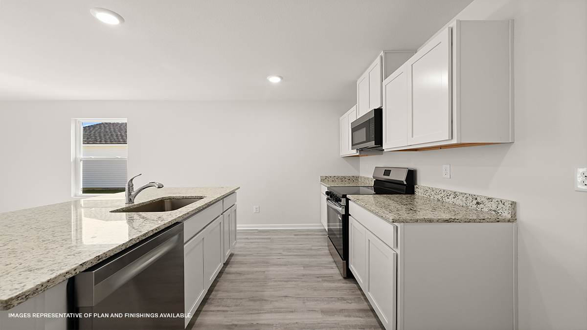 white kitchen island with stainless steel appliances and stools with access to pantry