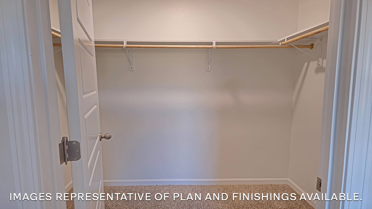 walk in closet in primary bedroom