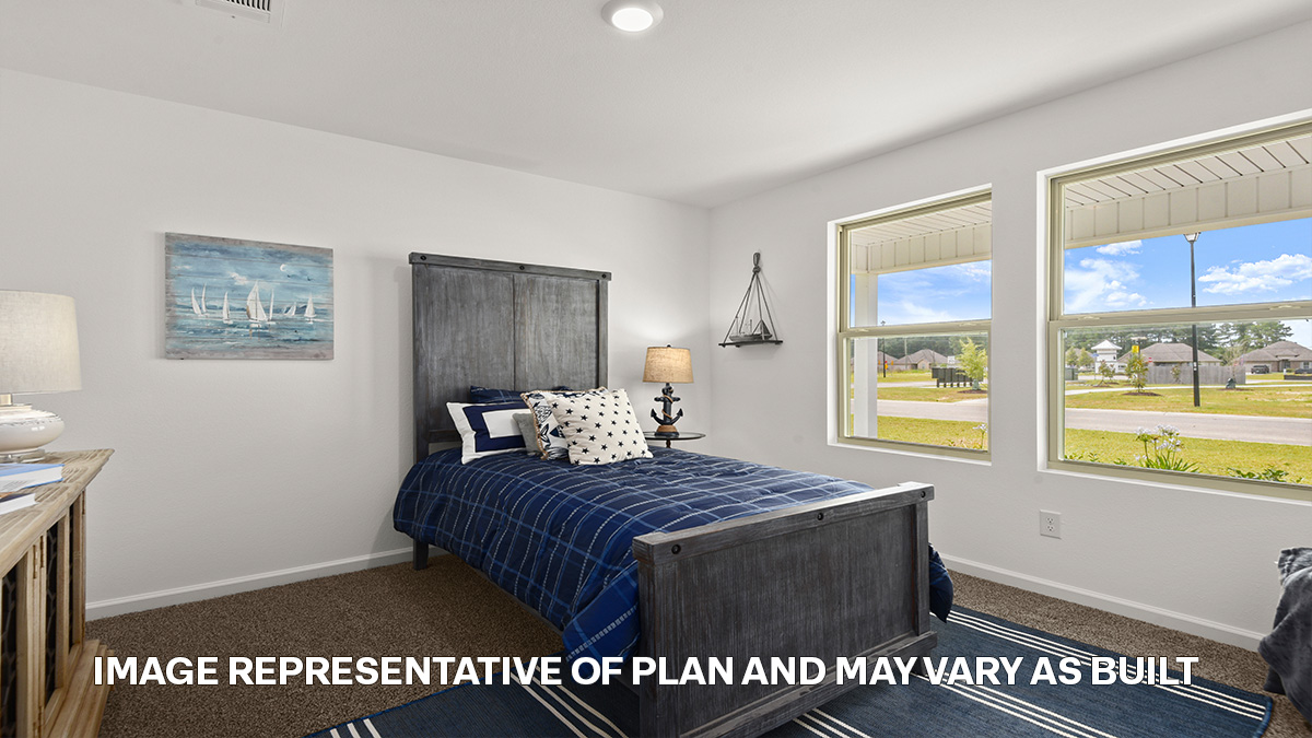 second bedroom with dual windows and room for a queen bed