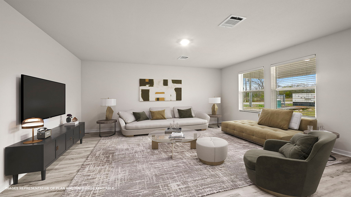 Spacious living room in the rear of home with dual windows facing backyard