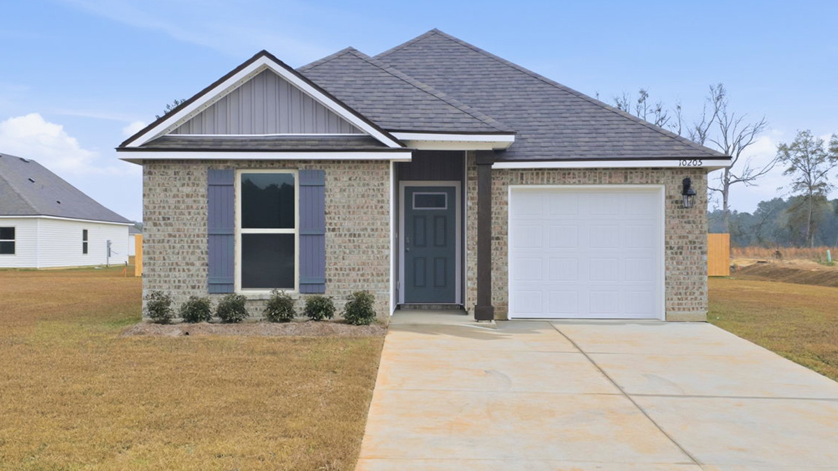 single-story home with tan brick and gray vinyl siding with grey front door and shutters with one-car garage
