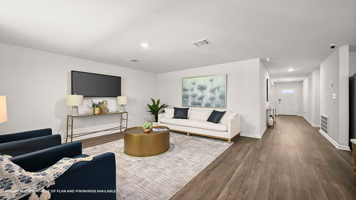 Spacious living room in the rear of home with dual windows facing backyard