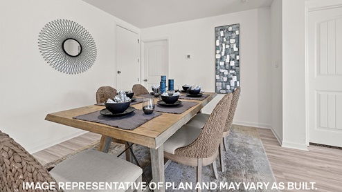 open-concept dining room with access to laundry room