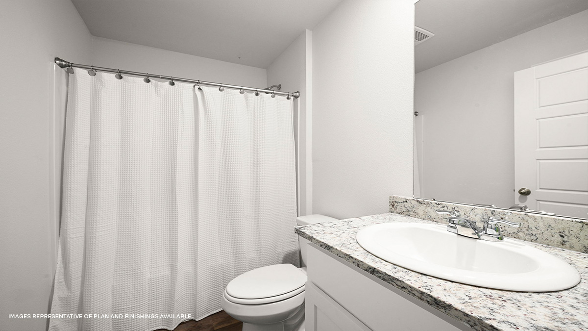 Guest bathroom with vanity, mirror, toilet and shower tub combo