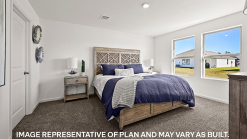primary bedroom with room for a king-sized bed and rear facing window