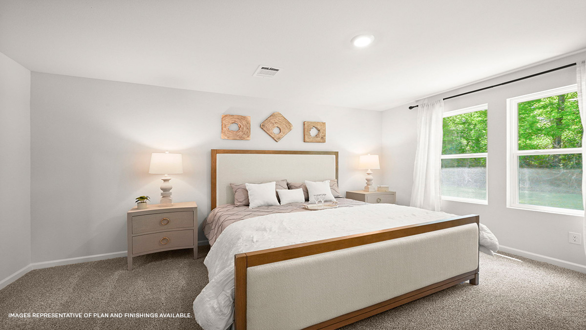 Primary bedroom with space for king size bedroom set and dual windows