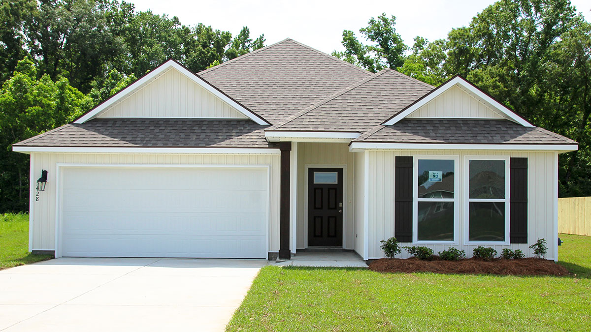 Single-story home with cream hardie vinyl. Black front door with black shutters and white trim.