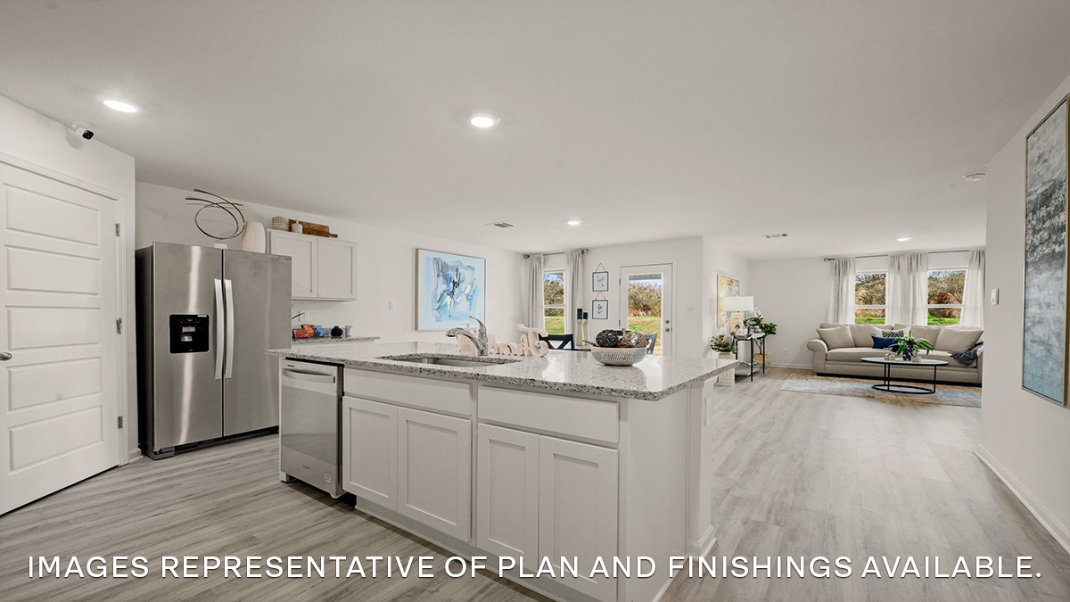 white kitchen island cabinets with stainless steel appliances and stools and access to dining and living room