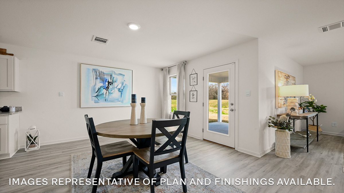 open-concept dining room with access to patio