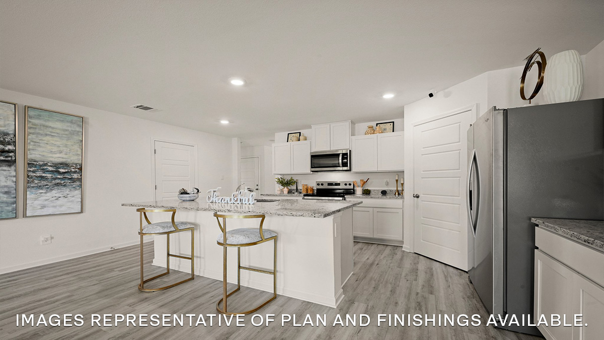white kitchen island cabinets with stainless steel appliances and stools and pantry access