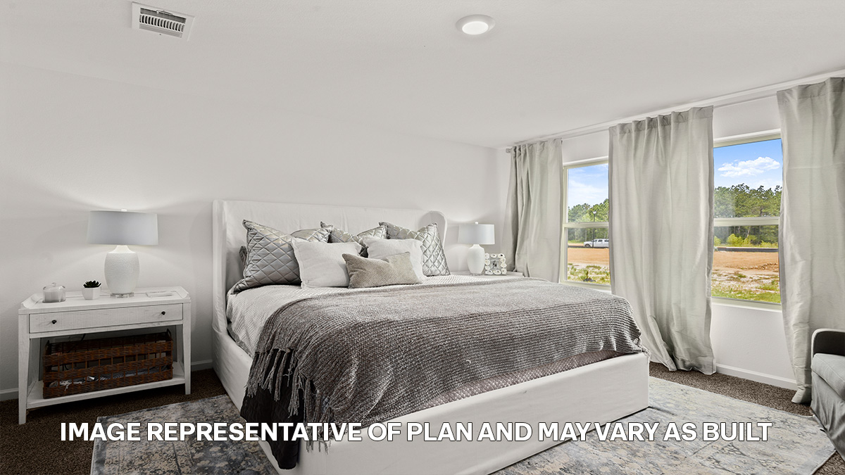 primary bedroom with room for a king-sized bed and rear facing window