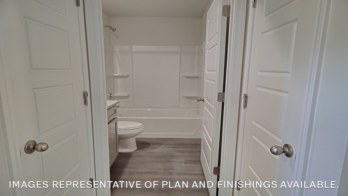 hall with two closets near second bathroom