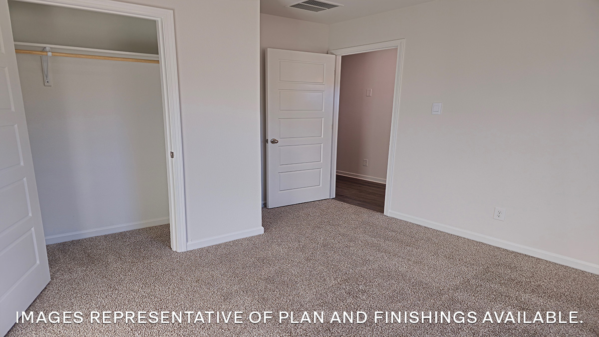 second bedroom with single window and room for up to a full size bed set