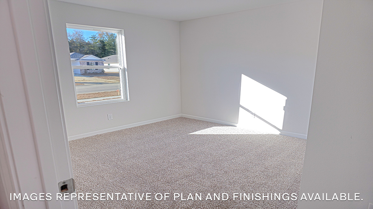 second bedroom with single window and room for up to a full size bed set