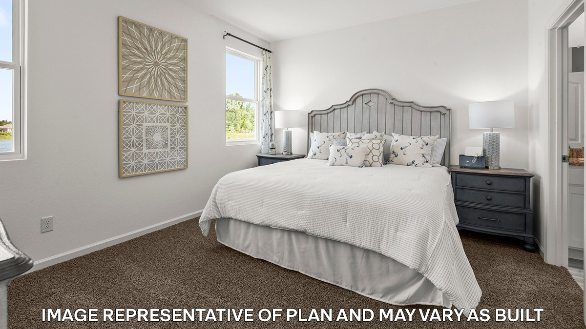 primary bedroom with room for a king-sized bed and rear facing window