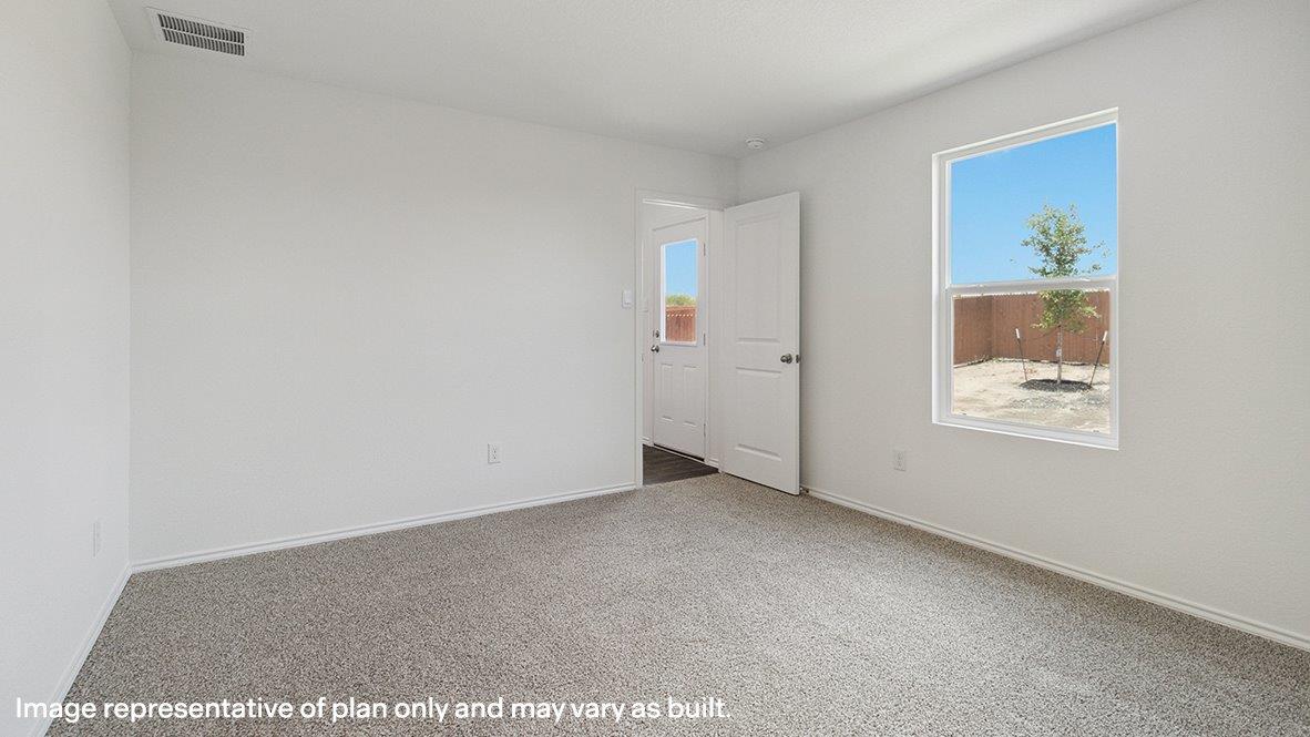 Empty room featuring carpet floors and baseboards