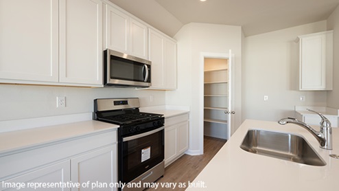 Modern open-concept living and kitchen area with granite countertops