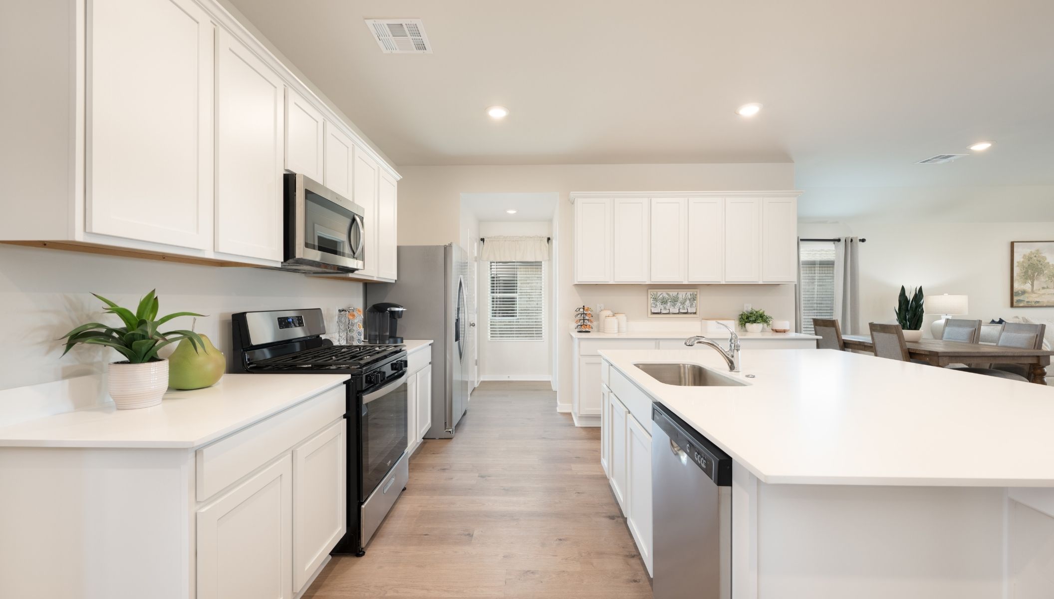 kitchen with painted cabinets and corner pantry