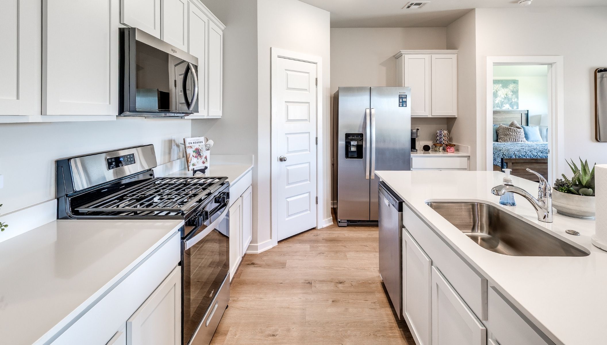 kitchen with corner pantry and painted cabinets