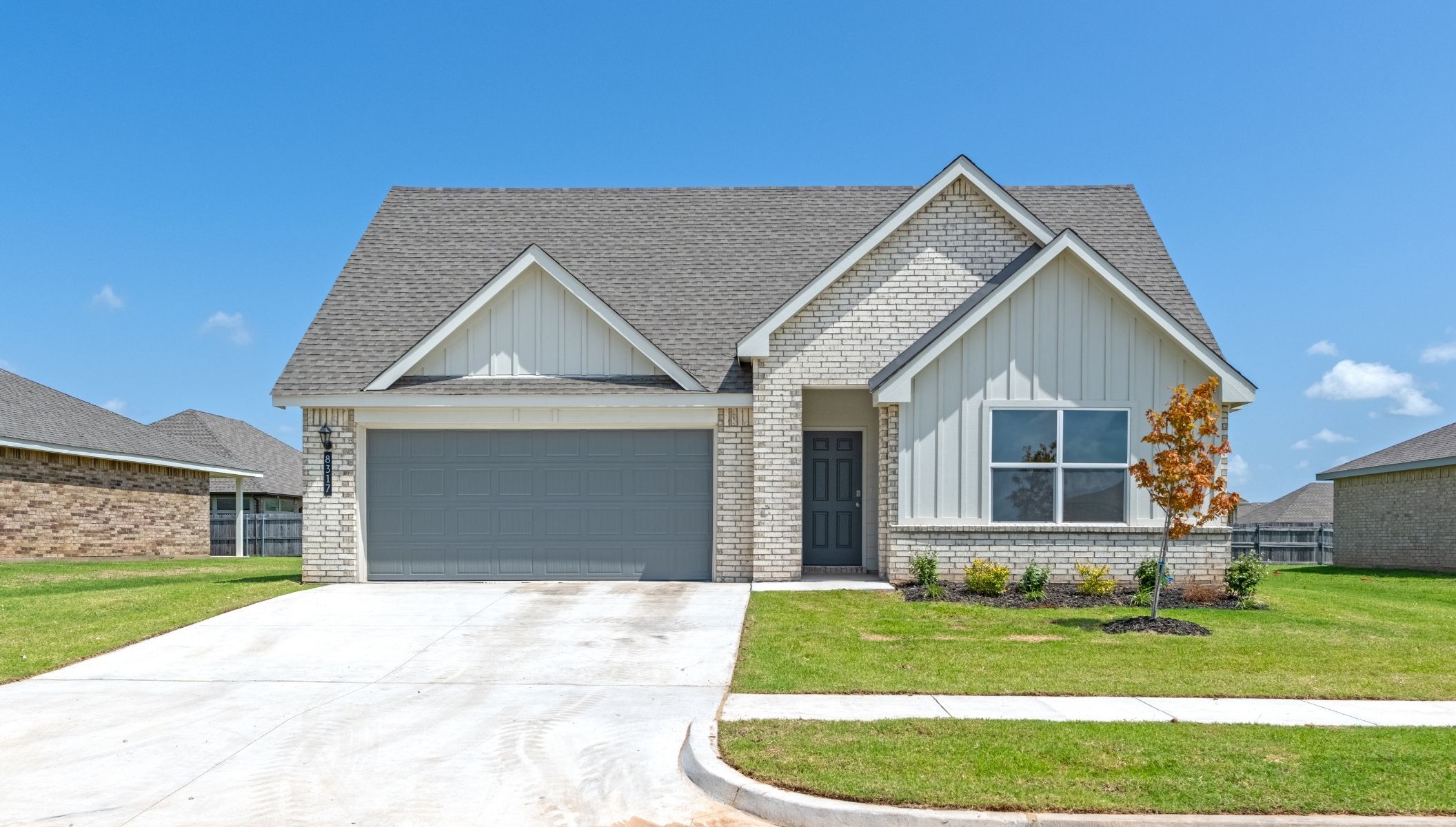 Single story home with brick and two car garage