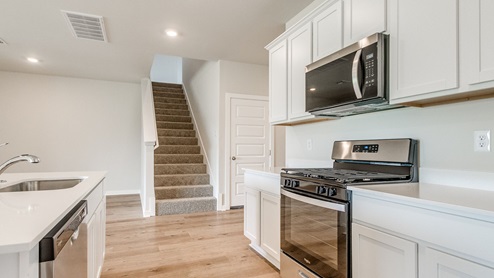 kitchen with stove and microwave