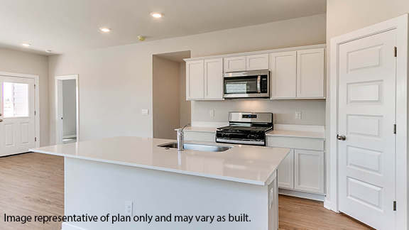 Kitchen with stainless steel appliances and quartz counter