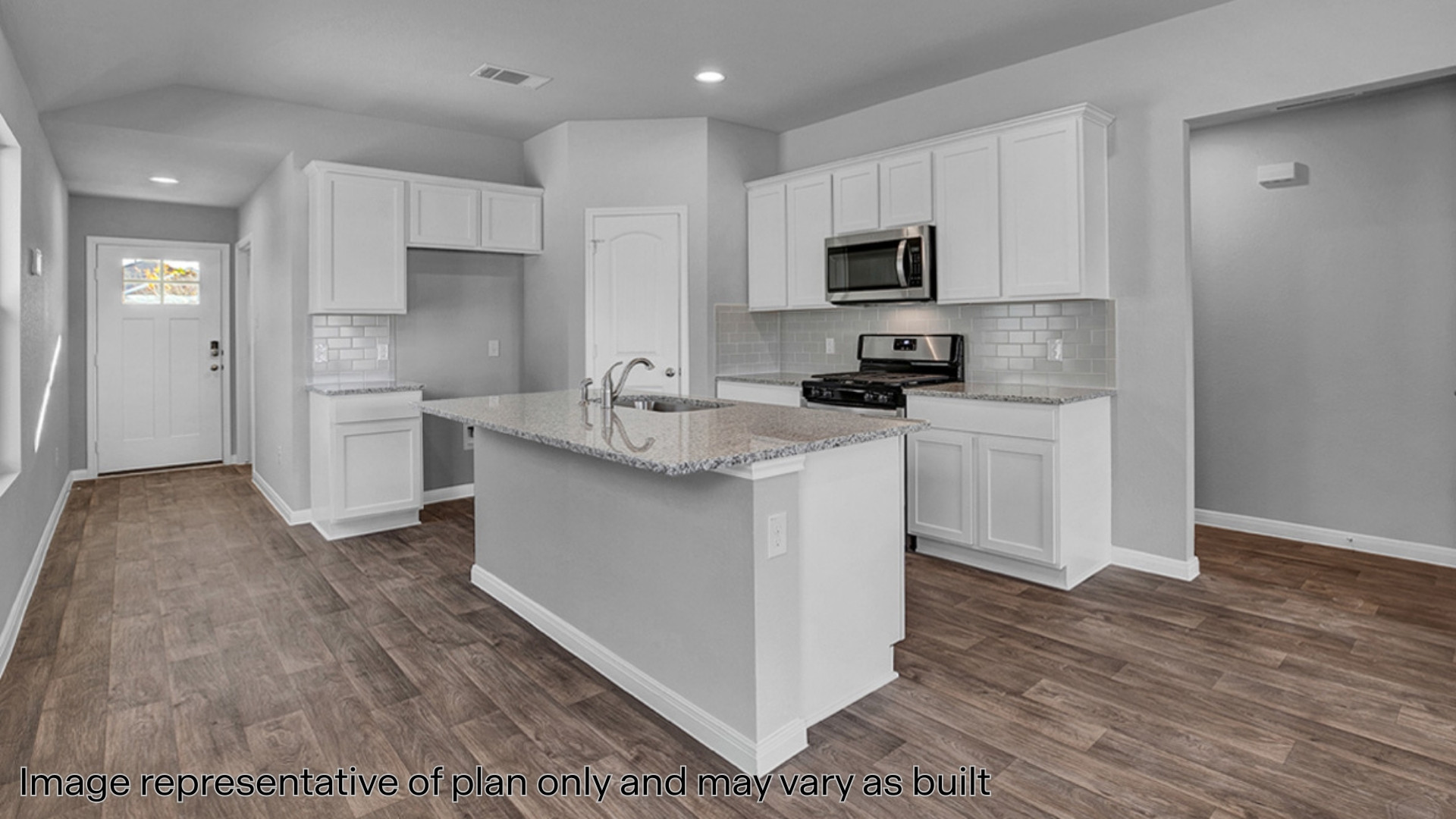Kitchen with quartz countertops and stainless steel appliances