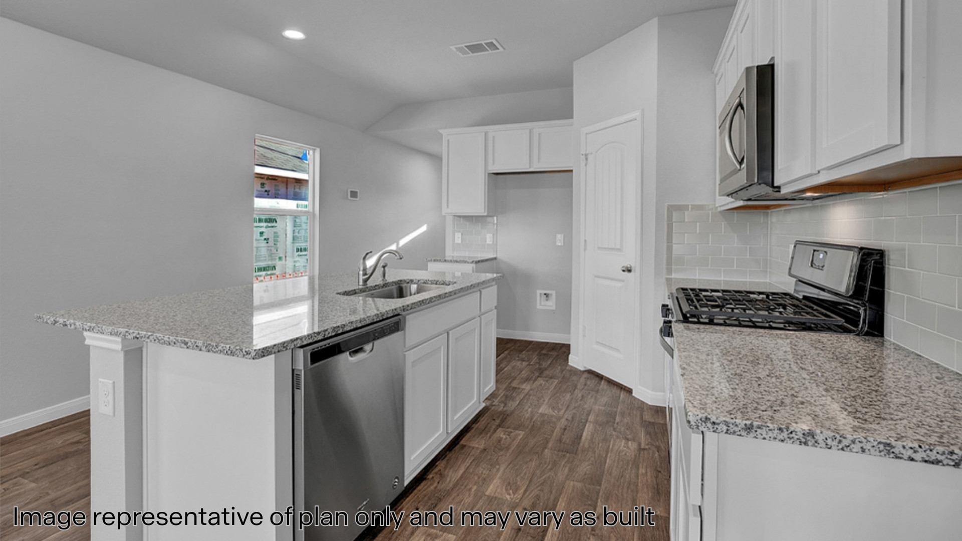 Kitchen with quartz countertops and stainless steel appliances