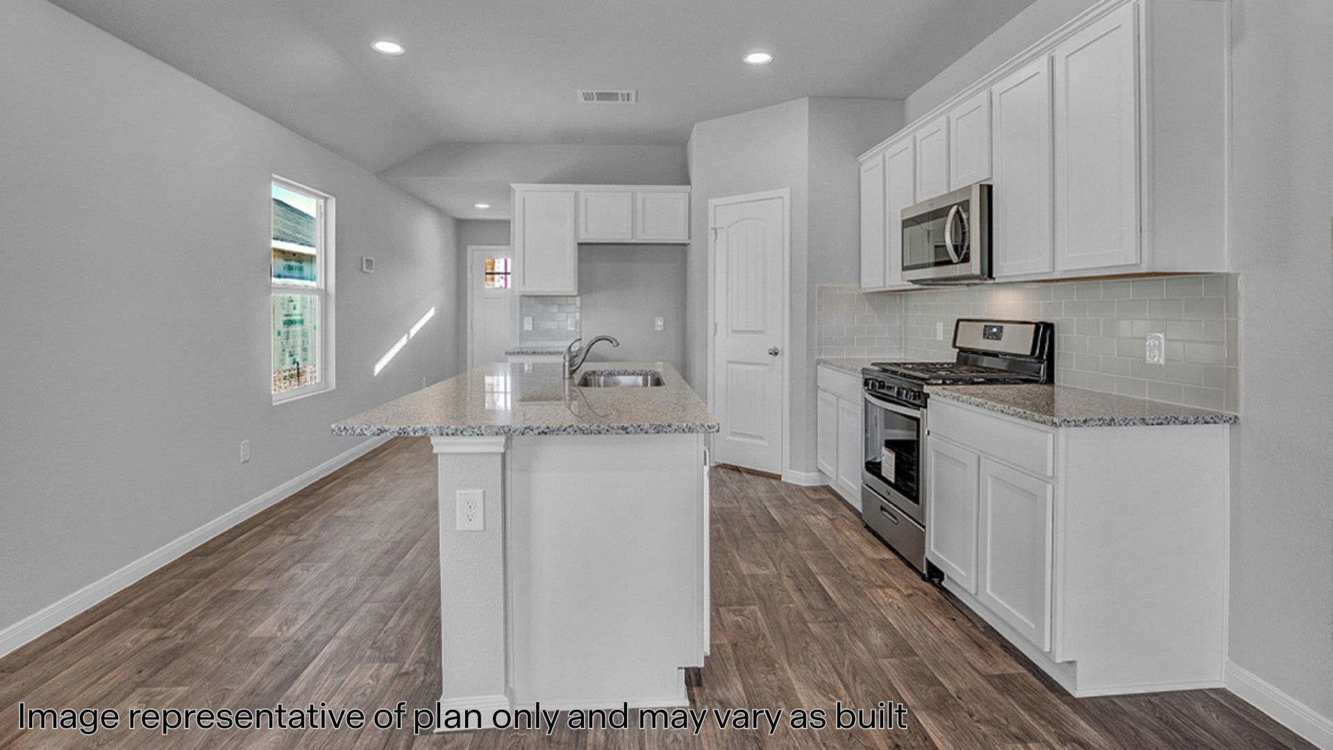 Kitchen with quartz countertops and stainless steel appliances