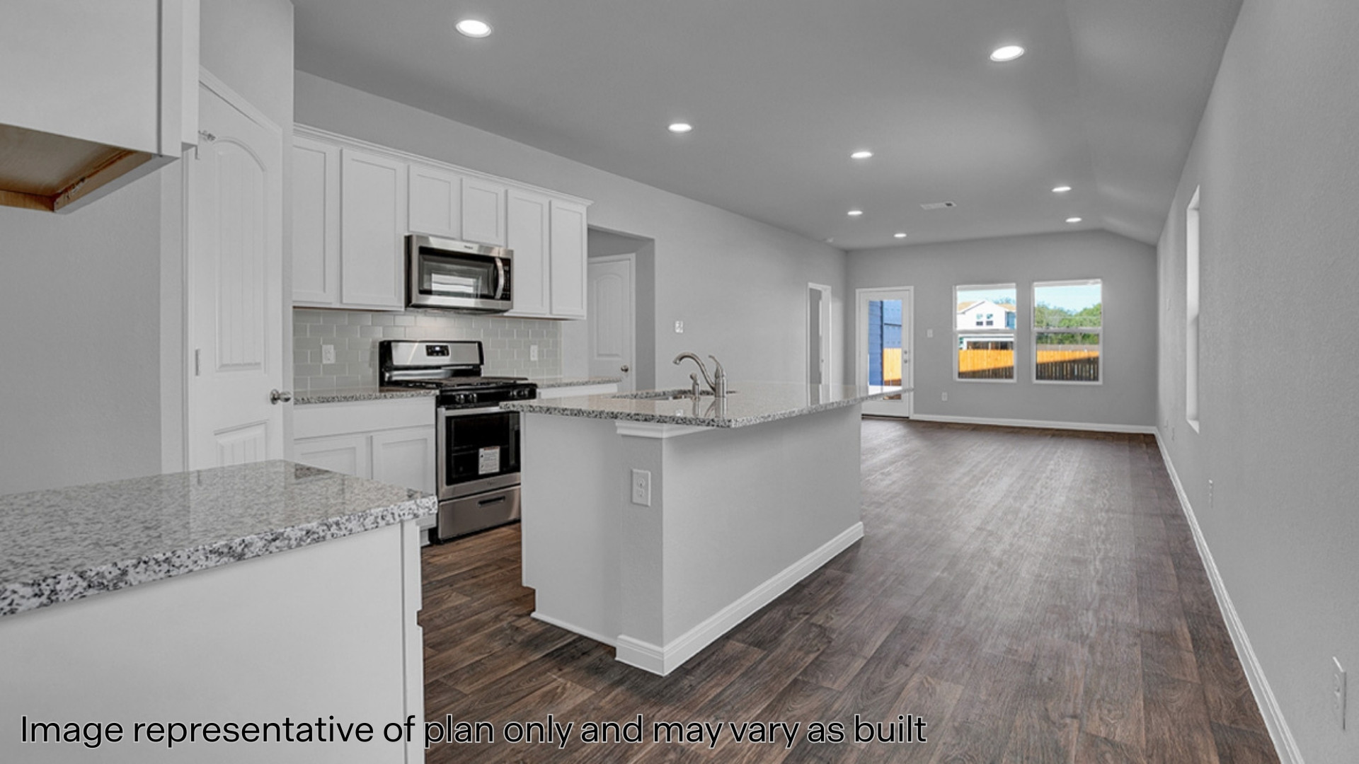 Kitchen with quartz countertops and stainless steel appliances
