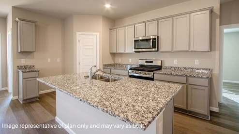open floor plan kitchen grey cabinetry with granite countertops and stainless steel
