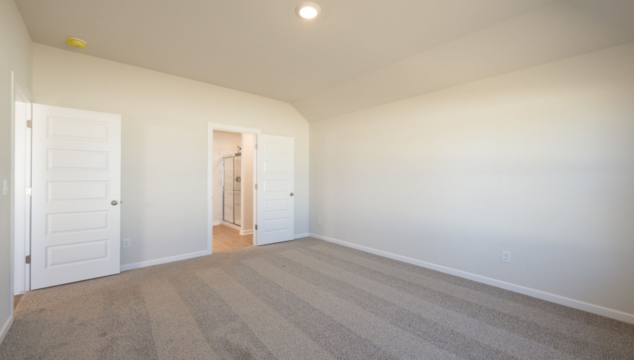 primary bedroom with ensuite bathroom