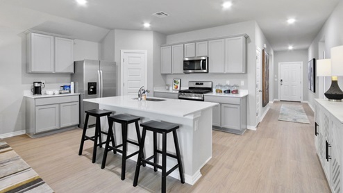 kitchen with island and painted cabinets
