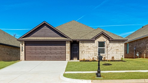 Single story home with brick and two car garage