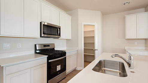Welcome to the Denton floor plan, where modern charm meets cozy elegance in the heart of The Montereau Community, nestled in scenic Yukon, Oklahoma. This one-story haven offers 3 bedrooms, 2 baths, and a generous 1575 square feet of living space, perfect for those seeking a warm and inviting retreat. From the outside, admire the traditional brick or brick and rock exterior, exuding timeless allure and modern curb appeal. Step inside to discover an open concept layout that effortlessly combines style and functionality. The kitchen features painted white shaker-style cabinets, quartz countertops, and stainless steel appliances, creating a welcoming atmosphere that overlooks the dining area and living room, ideal for gatherings and entertaining. As you explore further, you'll find comfort in every corner. Sink your feet into plush carpeting in the bedrooms, while the main living areas and halls boast durable luxury vinyl wood flooring, adding a touch of rustic charm to your everyday life. Indulge in the luxury of the primary suite, complete with a dual vanity, huge walk-in closet, separate water closet, and a large walk-in shower, ensuring your comfort and convenience. Experience the convenience of smart home features included in every Denton floor plan. Schedule a tour today and discover your perfect blend of modern luxury and cozy warmth at The Montereau Community in Yukon, Oklahoma.