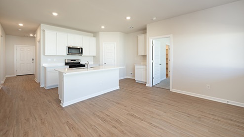 Welcome to the Denton floor plan, where modern charm meets cozy elegance in the heart of The Montereau Community, nestled in scenic Yukon, Oklahoma. This one-story haven offers 3 bedrooms, 2 baths, and a generous 1575 square feet of living space, perfect for those seeking a warm and inviting retreat. From the outside, admire the traditional brick or brick and rock exterior, exuding timeless allure and modern curb appeal. Step inside to discover an open concept layout that effortlessly combines style and functionality. The kitchen features painted white shaker-style cabinets, quartz countertops, and stainless steel appliances, creating a welcoming atmosphere that overlooks the dining area and living room, ideal for gatherings and entertaining. As you explore further, you'll find comfort in every corner. Sink your feet into plush carpeting in the bedrooms, while the main living areas and halls boast durable luxury vinyl wood flooring, adding a touch of rustic charm to your everyday life. Indulge in the luxury of the primary suite, complete with a dual vanity, huge walk-in closet, separate water closet, and a large walk-in shower, ensuring your comfort and convenience. Experience the convenience of smart home features included in every Denton floor plan. Schedule a tour today and discover your perfect blend of modern luxury and cozy warmth at The Montereau Community in Yukon, Oklahoma.