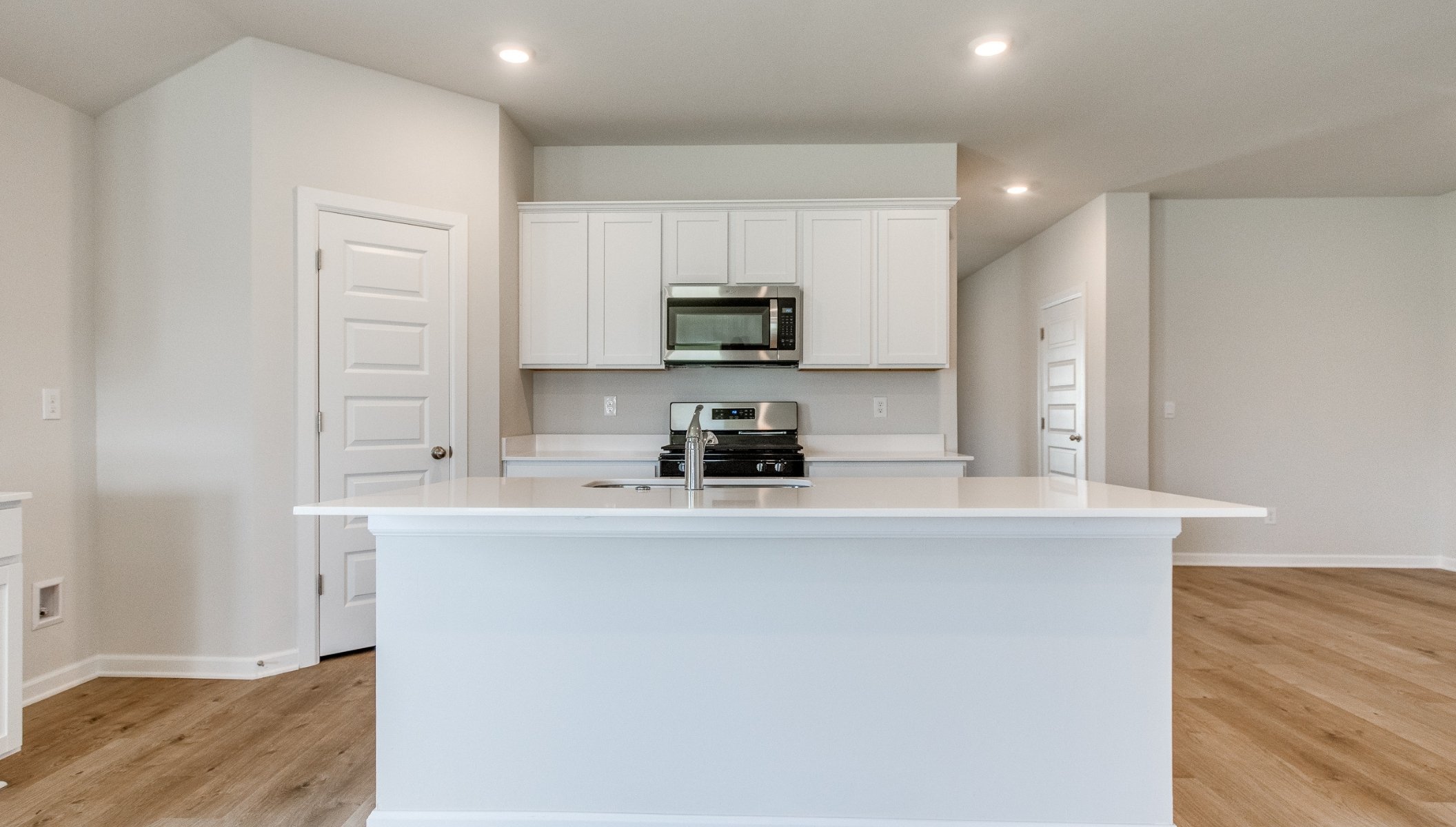 kitchen with island and painted cabinets