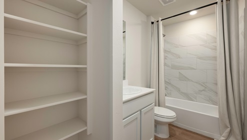 secondary bathroom with shelf
