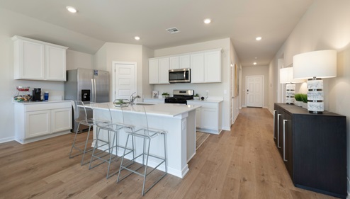 kitchen with painted cabinets and corner pantry