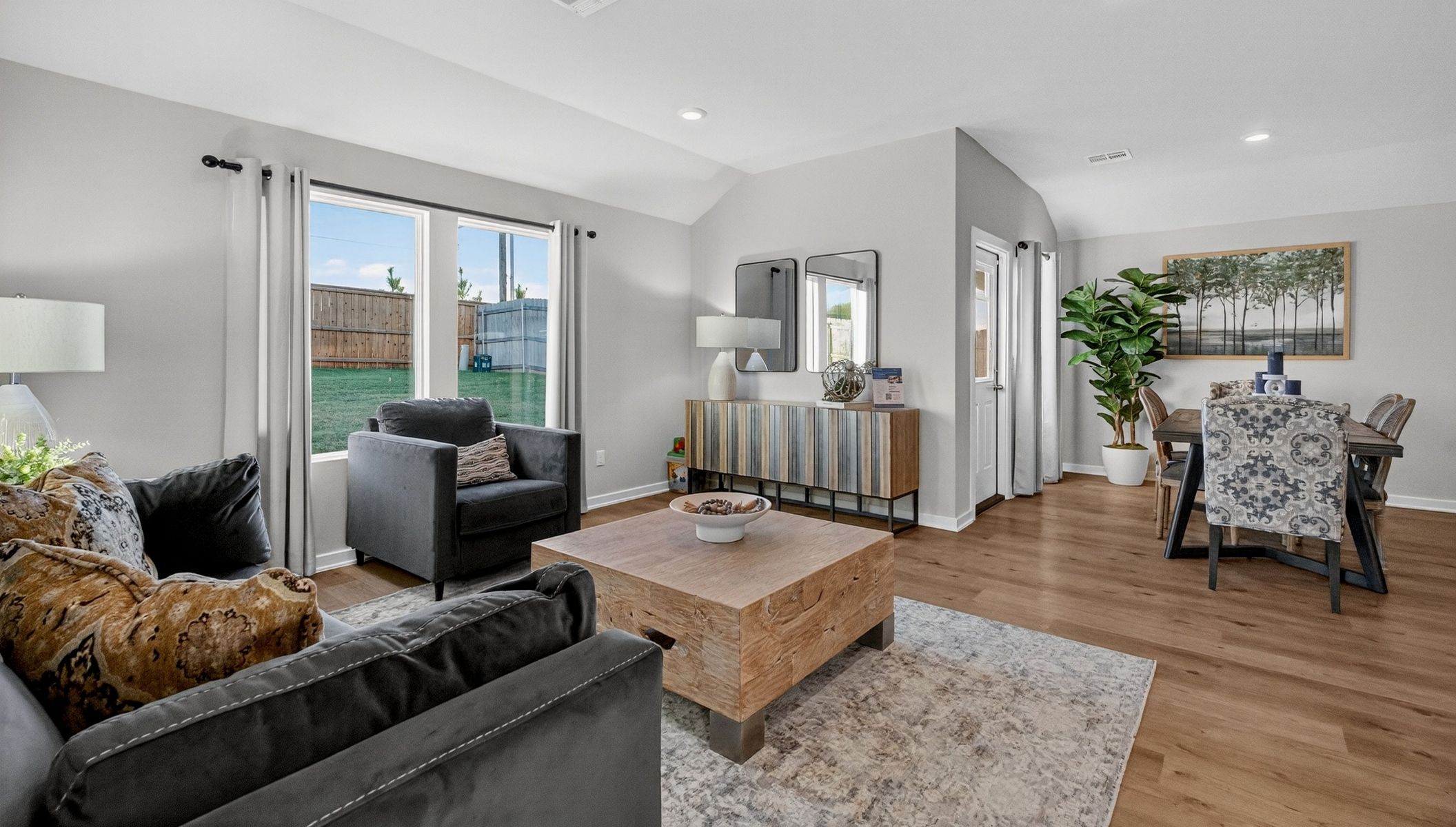 living room with large windows and open concept floor plan
