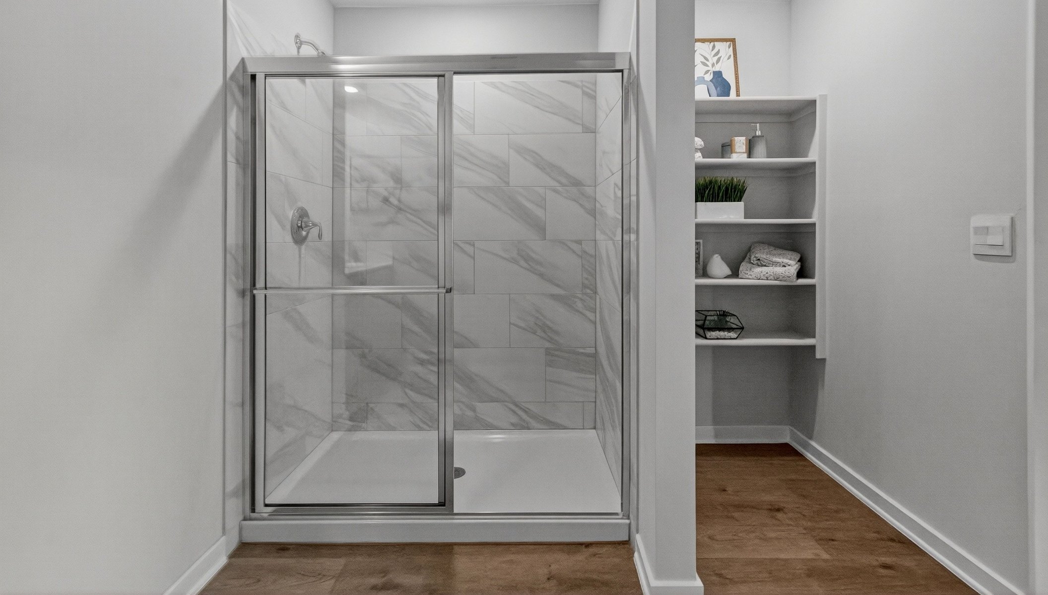 shower and storage in primary bathroom