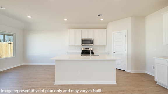 Kitchen with quartz countertops and stainless steel appliances