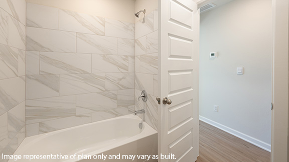 Front guest bathroom with shower and bath combo
